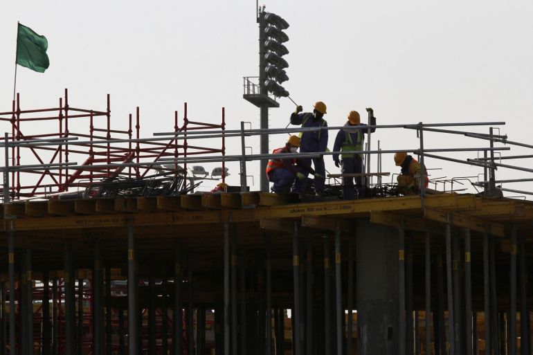 Migrant labourers work at a construction site at the Aspire Zone in Doha, Qatar, March 26, 2016. Workers in Qatar renovating a 2022 World Cup stadium have suffered human rights abuses two years after the tournament's organisers drafted worker welfare standards in the wake of criticism, Amnesty International said. REUTERS/Naseem Zeitoon