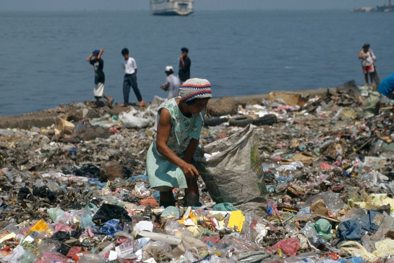Smokey Mountian is the main rubbish dump in Manila. Around 250 - 300 families live on the dump, the main source of income for the families is to search through the rubbish for plastic bottles, scrap metal or paper can that be sold for recycling.