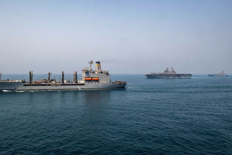 Fleet replenishment oiler USNS Big Horn (L), amphibious assault ship USS Boxer (C), and fleet replenishment oiler USNS Tippecanoe transit the Arabian Gulf, according to the U.S. Navy in this picture released on July 24, 2019. Kyle Carlstrom/U.S. Navy/Handout via REUTERS ATTENTION EDITORS- THIS IMAGE HAS BEEN SUPPLIED BY A THIRD PARTY.