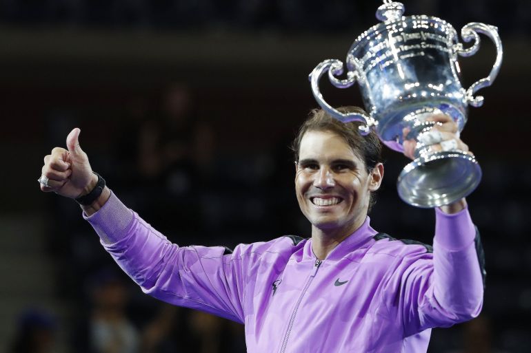Sep 8, 2019; Flushing, NY, USA; Rafael Nadal of Spain celebrates with the championship trophy during the ceremony after his match against Daniil Medvedev of Russia (not pictured) in the menÕs singles final on day fourteen of the 2019 US Open tennis tournament at USTA Billie Jean King National Tennis Center. Mandatory Credit: Geoff Burke-USA TODAY Sports