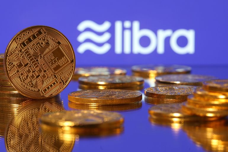 Representations of virtual currency are displayed in front of the Libra logo in this illustration picture, June 21, 2019. REUTERS/Dado Ruvic/Illustration