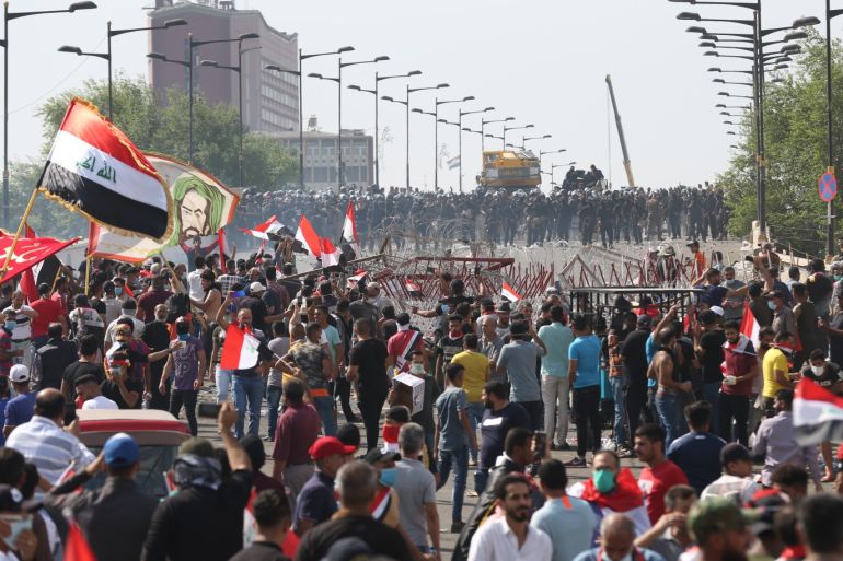 Demonstrations in Iraq- - BAGHDAD, IRAQ - OCTOBER 25 : People gather at Tahrir Square to protest against unemployment, corruption and lack of public services in Baghdad, Iraq on October 25, 2019.