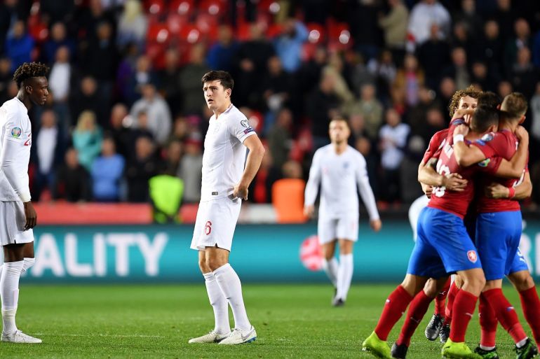 PRAGUE, CZECH REPUBLIC - OCTOBER 11: Harry Maguire of England looks on as players from Czech Republic celebrate at the final whistle the UEFA Euro 2020 qualifier between Czech Republic and England at Sinobo Stadium on October 11, 2019 in Prague, . (Photo by Justin Setterfield/Getty Images)