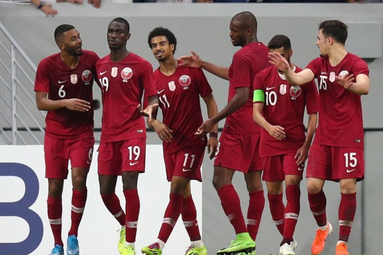 Soccer Football - 2022 World Cup Qualifier Round 2 - Group E - Qatar v Oman - Al Janoub Stadium, Al Wakrah, Qatar - October 15, 2019 Qatar's Ali Almoez celebrates scoring their second goal with team mates REUTERS/Ibraheem Al Omari