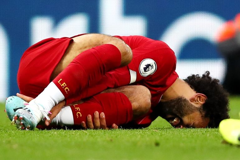LIVERPOOL, ENGLAND - OCTOBER 05: Mohamed Salah of Liverpool is injured during the Premier League match between Liverpool FC and Leicester City at Anfield on October 05, 2019 in Liverpool, United Kingdom. (Photo by Clive Brunskill/Getty Images)