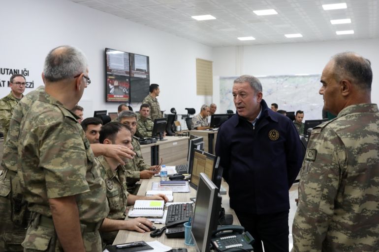 Operation Peace Spring- - SANLIURFA, TURKEY - OCTOBER 12: Turkish National Defense Minister, Hulusi Akar (2nd R) views the current status on Operation Peace Spring at the Operation Center in Sanliurfa, Turkey on October 12, 2019. Turkish troops along with the Syrian National Army (SNA) began Operation Peace Spring against the PKK/YPG and Daesh terrorists east of the Euphrates River in northern Syria to secure its borders by eliminating terrorist elements and to ensure t