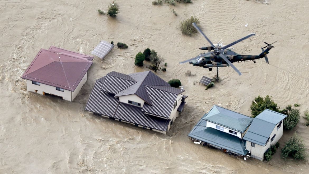 An aerial view shows a Japan Self-Defence Force helicopter flying over residential areas flooded by the Chikuma river following Typhoon Hagibis in Nagano, central Japan, October 13, 2019, in this photo taken by Kyodo. Mandatory credit Kyodo/via REUTERS ATTENTION EDITORS - THIS IMAGE WAS PROVIDED BY A THIRD PARTY. MANDATORY CREDIT. JAPAN OUT.
