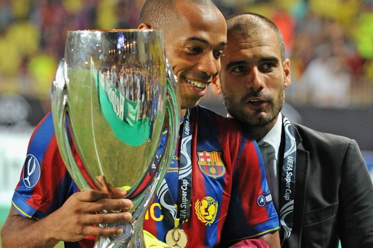 MONTE CARLO, MONACO - AUGUST 28: Josep Guardiola and Thierry Henry of Barcelona hold the trophy after defeating the Shakhtar Donetsk at the UEFA Super Cup Final at the Stade Louis II on August 28, 2009 in Monte Carlo, Monaco. (Photo by Laurence Griffiths/Getty Images)