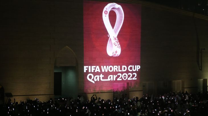 Qatar reveals 2022 World Cup logo- - DOHA, QATAR - SEPTEMBER 03: Hundreds of people take a photo as the official logo of the 'FIFA World Cup Qatar 2022' is reflected on a wall of the Amphitheatre in Doha, Qatar on September 03, 2019.