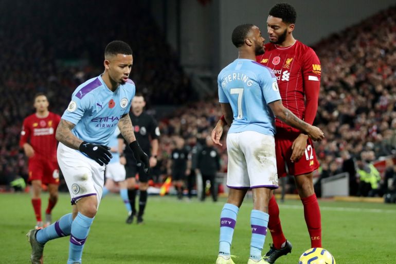Soccer Football - Premier League - Liverpool v Manchester City - Anfield, Liverpool, Britain - November 10, 2019 Liverpool's Joe Gomez and Manchester City's Raheem Sterling clash Action Images via Reuters/Carl Recine EDITORIAL USE ONLY. No use with unauthorized audio, video, data, fixture lists, club/league logos or