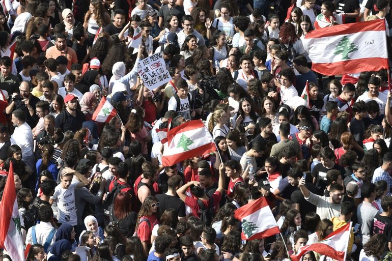 Lebanese students from various schools wave national flags and shout slogans during ongoing anti-government protests in front of the Ministry of Education in Beirut, Lebanon, 07 November 2019. Protesters demand the president make parliamentary consultations immediately to facilitate the formation of a new government that replaces the recently resigned cabinet. They also demand the formation of a technocratic government with no political affiliation. Saad Hariri resigned as Prime Minister on 29 October, bringing down the entire cabinet. EPA-EFE/WAEL HAMZEH