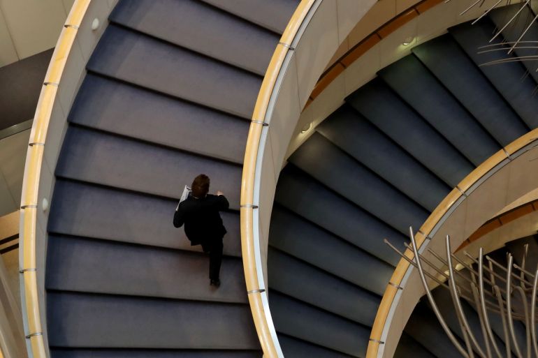 A man walks up the stairs in the European Parliament in Brussels, Belgium October 2, 2019. REUTERS/Yves Herman