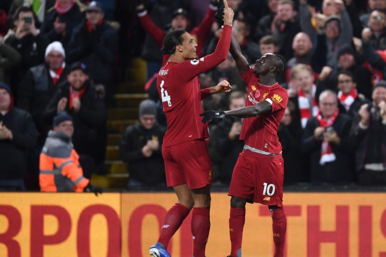 LIVERPOOL, ENGLAND - NOVEMBER 10: Sadio Mane of Liverpool celebrates after scoring his team's third goal with teammate Virgil van Dijk during the Premier League match between Liverpool FC and Manchester City at Anfield on November 10, 2019 in Liverpool, United Kingdom. (Photo by Laurence Griffiths/Getty Images)