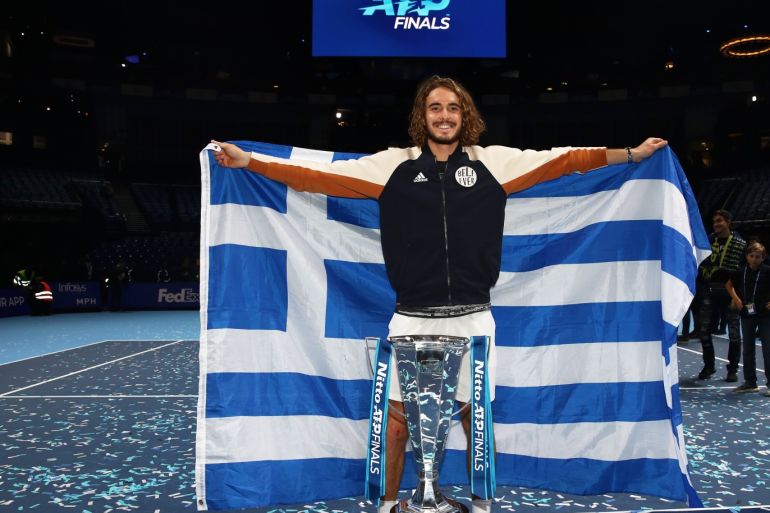 LONDON, ENGLAND - NOVEMBER 17: Stefanos Tsitsipas of Greece celebrates with the trophy after his singles final match victory against Dominic Thiem of Austria during Day Eight of the Nitto ATP World Tour Finals at The O2 Arena on November 17, 2019 in London, England. (Photo by Julian Finney/Getty Images)