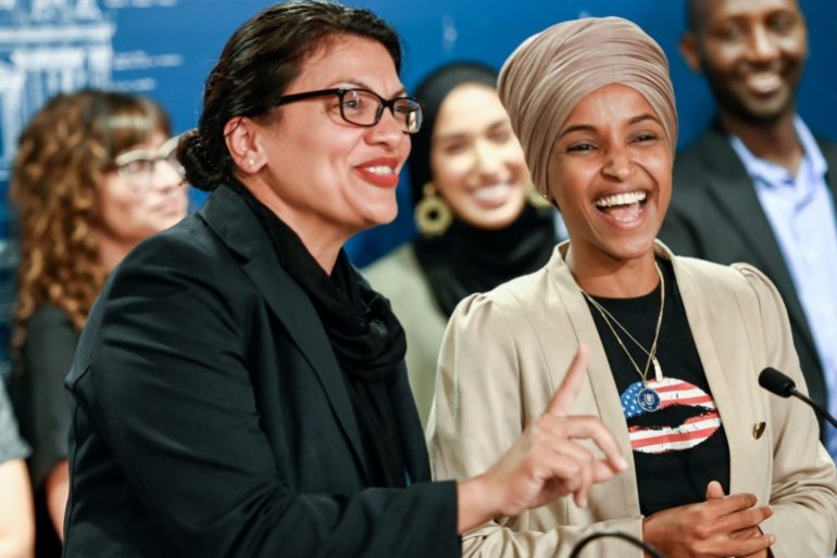 U.S. Representatives Rashida Tlaib (D-MI) and Ilhan Omar (D-MN) react as they discuss travel restrictions to Palestine and Israel during a news conference at the Minnesota State Capitol Building in St Paul, Minnesota, August 19, 2019. REUTERS/Caroline Yang