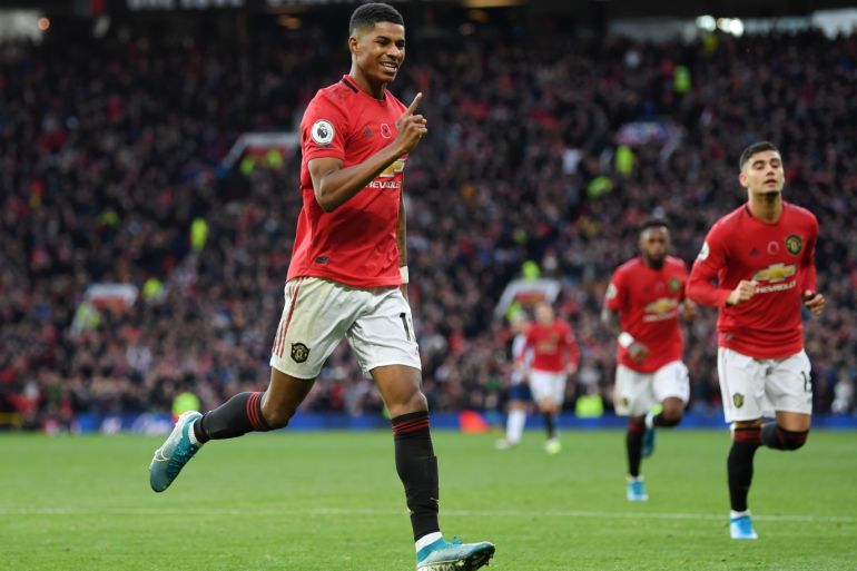 MANCHESTER, ENGLAND - NOVEMBER 10: Marcus Rashford of Manchester United celebrates after scoring his team's third goal during the Premier League match between Manchester United and Brighton & Hove Albion at Old Trafford on November 10, 2019 in Manchester, United Kingdom. (Photo by Michael Regan/Getty Images)