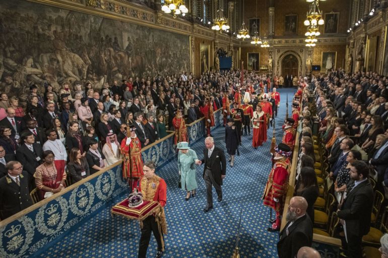 LONDON, ENGLAND - DECEMBER 19: Queen Elizabeth II and Prince Charles, Prince of Wales proceed through the Royal Gallery on their way to the Lord's Chamber to attend the State Opening of Parliament on December 19, 2019 in London, England. In the second Queen's speech in two months, Queen Elizabeth II unveiled the majority Conservative government's legislative programme to Members of Parliament and Peers in The House of Lords. (Photo by Jack Hill - WPA Pool/Getty Images)
