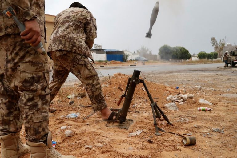 A fighter loyal to Libya's U.N.-backed government (GNA) fires a mortar during clashes with forces loyal to Khalifa Haftar on the outskirts of Tripoli, Libya May 25, 2019. REUTERS/Goran Tomasevic
