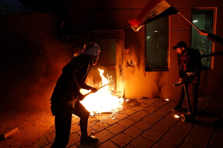 Protesters and militia fighters set fire to a reception room of the U.S. Embassy, during a protest to condemn air strikes on bases belonging to Hashd al-Shaabi (paramilitary forces), in Baghdad, Iraq December 31, 2019. REUTERS/Wissm al-Okili