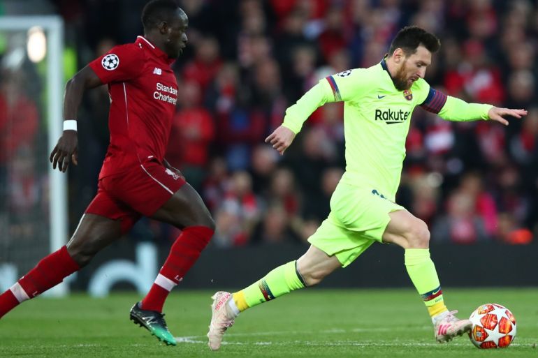 LIVERPOOL, ENGLAND - MAY 07: Lionel Messi of Barcelona is chased by Sadio Mane of Liverpool during the UEFA Champions League Semi Final second leg match between Liverpool and Barcelona at Anfield on May 07, 2019 in Liverpool, England. (Photo by Clive Brunskill/Getty Images)