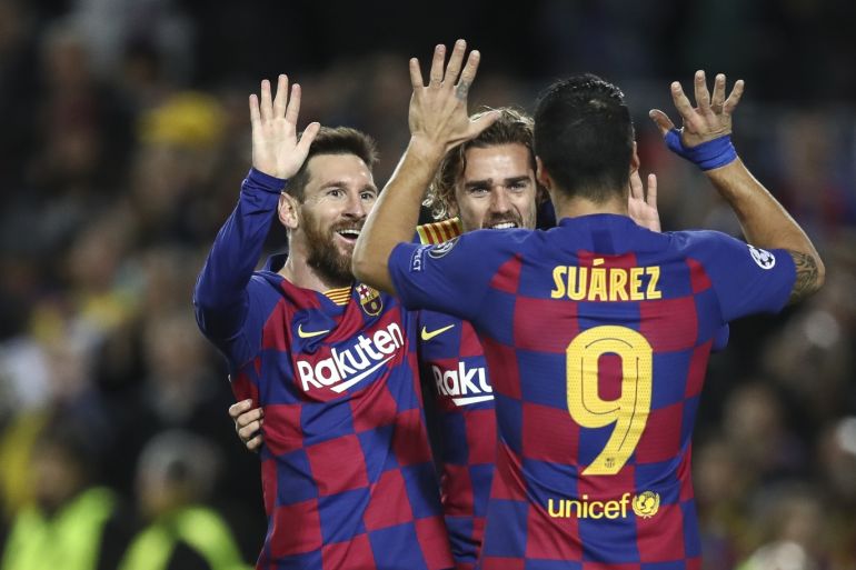 BARCELONA, SPAIN - NOVEMBER 27: Lionel Messi of Barcelona celebrates with Luis Suarez of Barcelona and Antoine Griezmann of FC Barcelona after scoring his team's second goal during the UEFA Champions League group F match between FC Barcelona and Borussia Dortmund at Camp Nou on November 27, 2019 in Barcelona, Spain. (Photo by Maja Hitij/Bongarts/Getty Images)