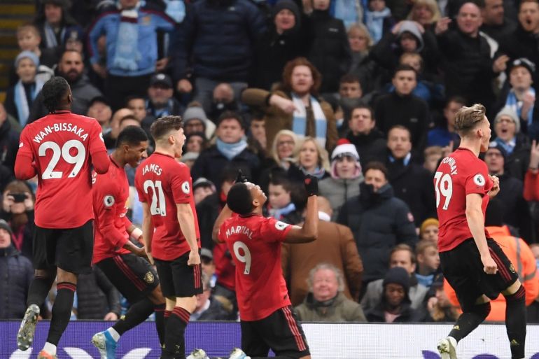MANCHESTER, ENGLAND - DECEMBER 07: Anthony Martial of Manchester United celebrates with teammates after scoring his team's second goal during the Premier League match between Manchester City and Manchester United at Etihad Stadium on December 07, 2019 in Manchester, United Kingdom. (Photo by Laurence Griffiths/Getty Images)