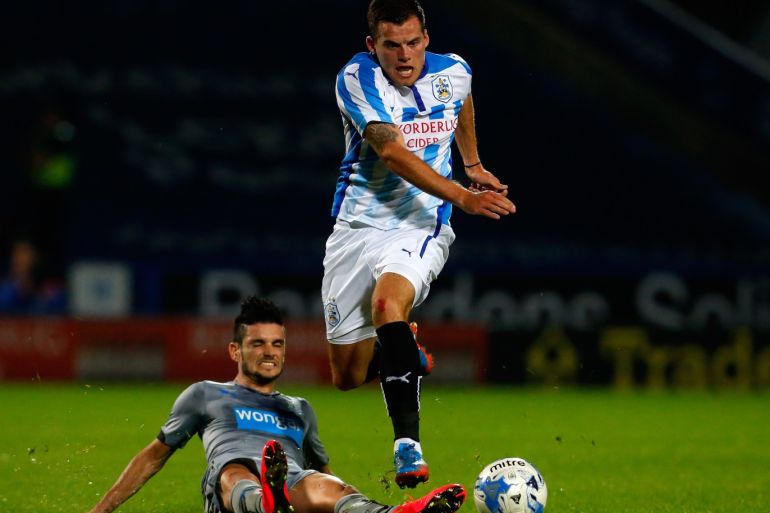 HUDDERSFIELD, ENGLAND - AUGUST 5: Jordan Sinnott (R) of Huddersfield in action with Remy Cabella of Newcastle during the Pre Season Friendly match between Huddersfield Town and Newcastle United at the John Smith's Stadium on August 5, 2014 in Huddersfield, England. (Photo by Paul Thomas/Getty Images)