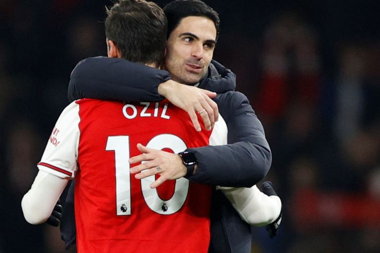 Soccer Football - Premier League - Arsenal v Manchester United - Emirates Stadium, London, Britain - January 1, 2020 Arsenal manager Mikel Arteta celebrates with Mesut Ozil after the match Action Images via Reuters/John Sibley EDITORIAL USE ONLY. No use with unauthorized audio, video, data, fixture lists, club/league logos or