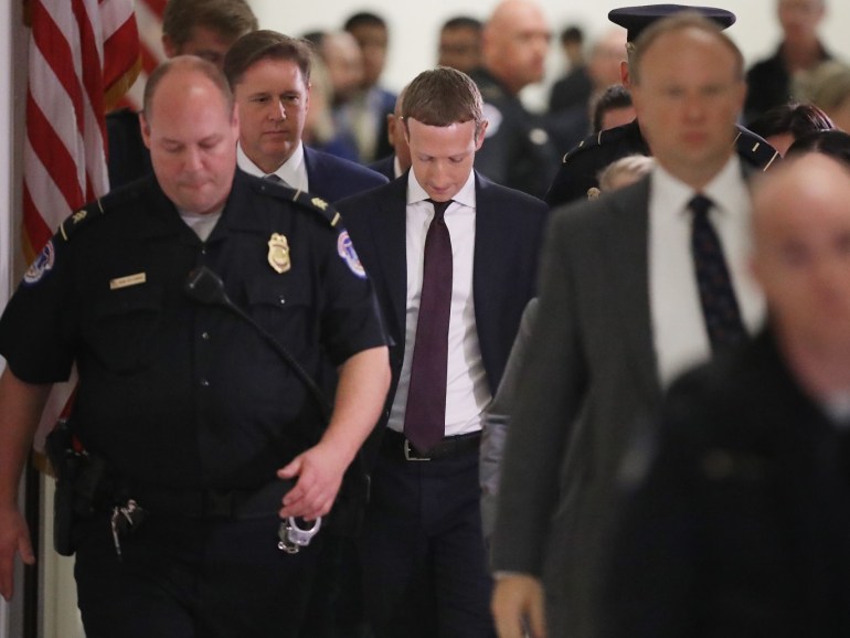 WASHINGTON, DC - OCTOBER 23: Facebook co-founder and CEO Mark Zuckerberg (C) leaves the Rayburn House Office Building after testifying before the House Financial Services Committee for six hours on Capitol Hill October 23, 2019 in Washington, DC. Zuckerberg testified about Facebook's proposed cryptocurrency Libra, how his company will handle false and misleading information by political leaders during the 2020 campaign and how it handles its users data and privacy. Chip Somodevilla/Getty Images/AFP== FOR NEWSPAPERS, INTERNET, TELCOS & TELEVISION USE ONLY ==