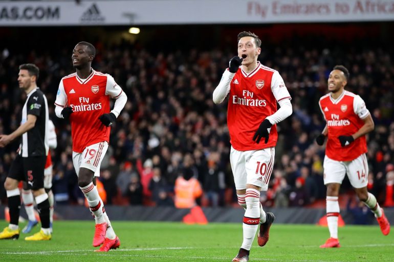LONDON, ENGLAND - FEBRUARY 16: Mesut Ozil of Arsenal celebrates after scoring his sides third goal during the Premier League match between Arsenal FC and Newcastle United at Emirates Stadium on February 16, 2020 in London, United Kingdom. (Photo by Richard Heathcote/Getty Images)