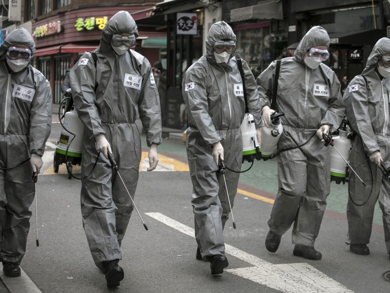 SEOUL, SOUTH KOREA - MARCH 04: South Korean soldiers, in protective gear, disinfect the Eunpyeong district against the coronavirus (COVID-19) on March 04, 2020 in Seoul, South Korea. The South Korean government has raised the coronavirus alert to the