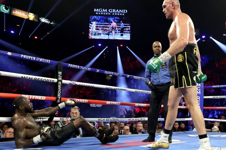 LAS VEGAS, NEVADA - FEBRUARY 22: Tyson Fury knocks down Deontay Wilder in the third round during their Heavyweight bout for Wilder's WBC and Fury's lineal heavyweight title on February 22, 2020 at MGM Grand Garden Arena in Las Vegas, Nevada. Al Bello/Getty Images/AFP== FOR NEWSPAPERS, INTERNET, TELCOS & TELEVISION USE ONLY ==