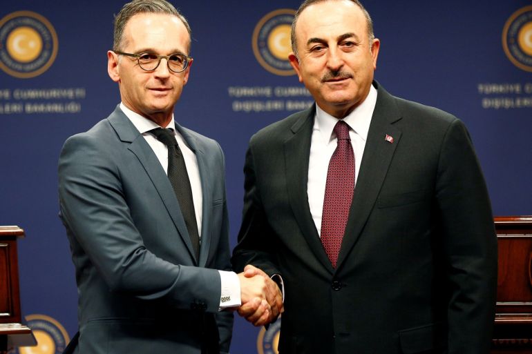 Turkish Foreign Minister Mevlut Cavusoglu and his German counterpart Heiko Maas shake hands, in Ankara, Turkey, October 26, 2019. REUTERS/Alp Eren Kaya