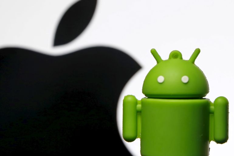 An Android mascot is seen in front of a displayed logo of Apple in this photo illustration taken in Zenica, Bosnia and Herzegovina, May 5, 2015. A U.S. appeals court on May 18, 2015 reversed part of a $930 million verdict that Apple Inc won in 2012 against Samsung Electronics Co Ltd, saying the iPhone maker's trademark-related appearance could not be protected. Some observers viewed the litigation as Apple's attempt to curtail the rapid rise of phones using Google Inc