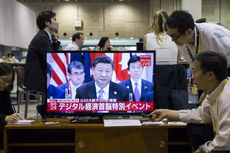 OSAKA, JAPAN - JUNE 28: Journalists watch a live broadcast of China's President Xi Jinping speaking during the first session of the G20 summit on June 28, 2019 in Osaka, Japan. U.S. President Donald Trump arrived in Osaka on Thursday for the annual Group of 20 gathering together with other world leaders who will use the two-day summit to discuss pressing economic, climate change, as well as geopolitical issues. The US-China trade war is expected to dominate the meetings in Osaka as President Trump and China's President Xi Jinping are scheduled to meet on Saturday in an attempt to resolve the ongoing the trade clashes between the world's two largest economies. (Photo by Tomohiro Ohsumi/Getty Images)