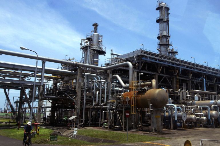 A worker cycles in Balongan refinery belonging to Indonesia's state oil firm Pertamina in Indramayu