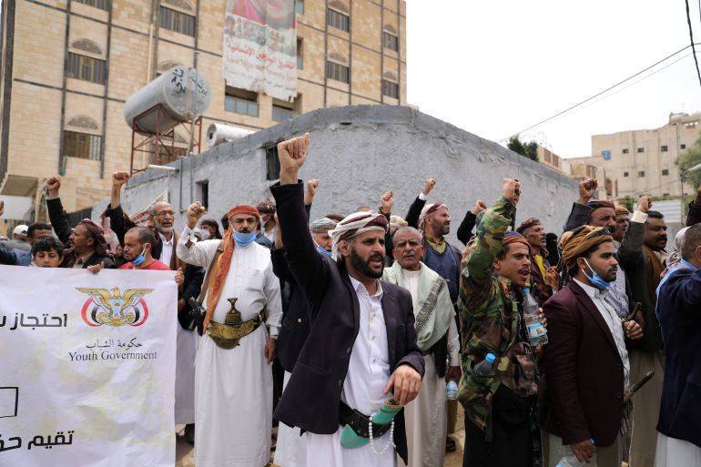 Houthis shout slogans as they gather outside the United Nations offices to denounce the Saudi-led coalition's blockade, in Sanaa