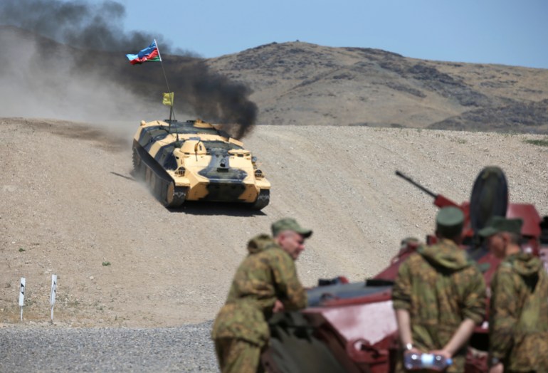 An Azerbaijani armoured vehicle drives during the International Army Games at a military base in Zhambyl Region