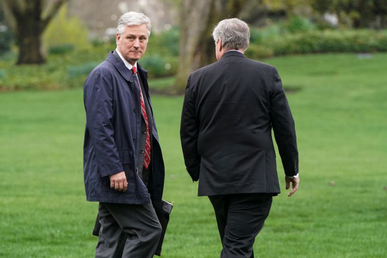 National Security Advisor Robert O'Brien walks with White House Chief of Staff Mark Meadows as U.S. President Donald Trump departs for a day trip to Norfolk, Virginia, from the White House in Washington, U.S., March 28, 2020. REUTERS/Joshua Roberts