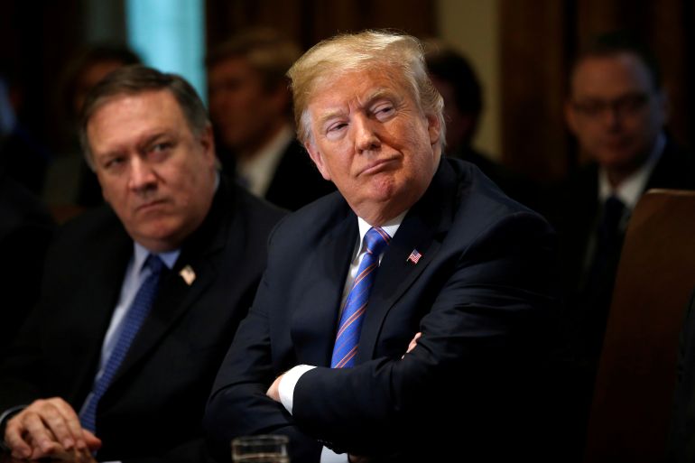 U.S. Secretary of State Pompeo and President Trump listen during cabinet meeting at the White House in Washington