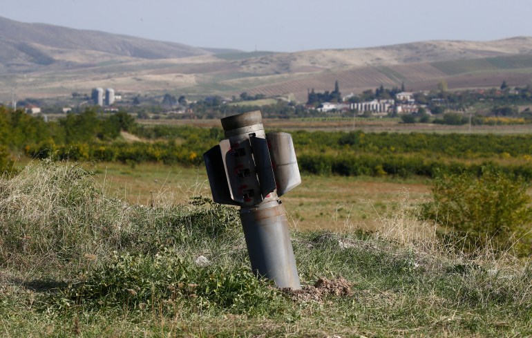 The remains of a rocket shell are seen after recent shelling during the military conflict over the breakaway region of Nagorno-Karabakh, in Martuni