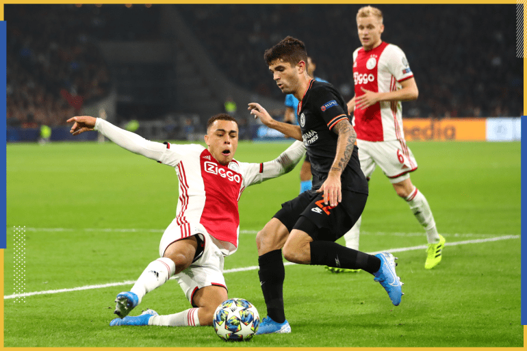 AMSTERDAM, NETHERLANDS - OCTOBER 23: Sergino Dest of Ajax tackles Christian Pulisic of Chelsea during the UEFA Champions League group H match between AFC Ajax and Chelsea FC at Amsterdam Arena on October 23, 2019 in Amsterdam, Netherlands. (Photo by Dean Mouhtaropoulos/Getty Images)