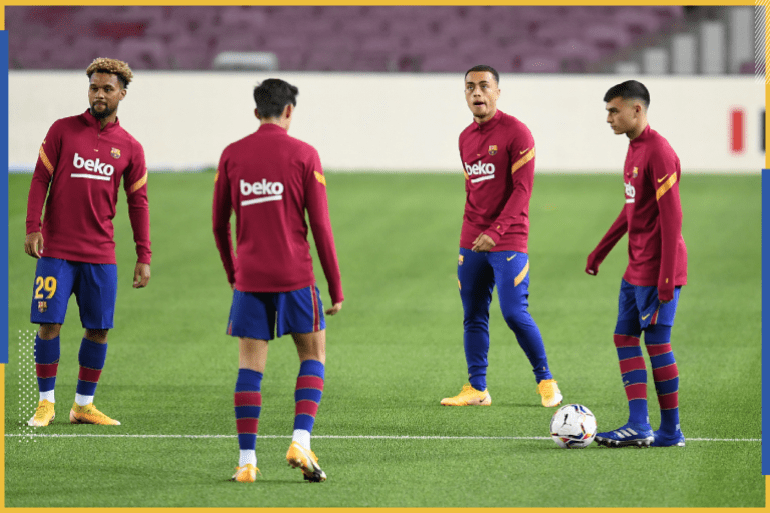 BARCELONA, SPAIN - OCTOBER 04: Sergino Dest of Barcelona (second from right) warms up with his team during the La Liga Santander match between FC Barcelona and Sevilla FC at Camp Nou on October 04, 2020 in Barcelona, Spain. Football Stadiums around Europe remain empty due to the Coronavirus Pandemic as Government social distancing laws prohibit fans inside venues resulting in fixtures being played behind closed doors. (Photo by David Ramos/Getty Images)
