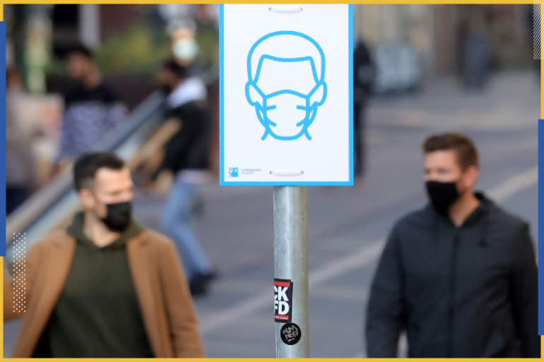 epa08811619 A sign 'Face mask obligation' in the city centre of Duesseldorf, Germany, 10 November 2020. On 09 November the Administrative Court of Muenster decided that the general decree of the city of Duesseldorf concerning the obligation to wear...