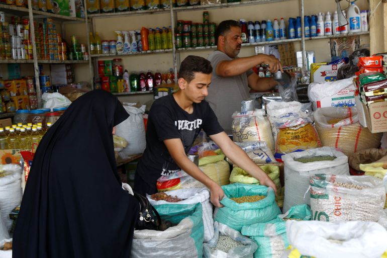 An Iraqi woman shops at a food market ahead of the holy month of Ramadan following the outbreak of the coronavirus disease (COVID-19), in the holy city of Najaf, Iraq April 23, 2020. REUTERS/Alaa al-Marjani
