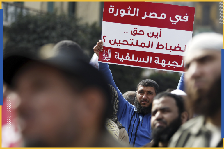 An Egyptian Salafi Muslim man holds up a sign reading "In Egypt after the revolution on the rights of bearded police(officers)" during a protest in front of Abdeen Presidential Palace in downtown Cairo March 1, 2013. Dozens of Salafi parties joined the protests dubbed "No to exclusion" on Friday to demand bearded police officers be allowed back to work, after Cairo's High Administrative Court issued a verdict allowing the officers to grow their beards, rejecting the Interior Ministry's request to suspend officers with beards. REUTERS/Amr Abdallah Dalsh (EGYPT - Tags: POLITICS CIVIL UNREST BUSINESS EMPLOYMENT RELIGION)