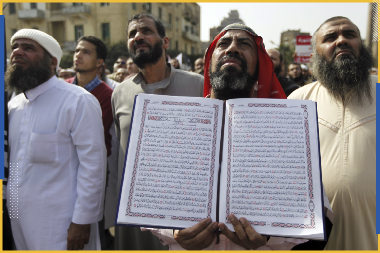 An Egyptian Salafi Muslim man holds a copy of the Koran during a protest in support of bearded police officers, who were suspended from work at the interior ministry because of their beards, in front of Abdeen Presidential Palace in downtown Cairo March 1, 2013. Dozens of Salafi parties joined the protests dubbed "No to exclusion" on Friday to demand bearded police officers be allowed back to work, after Cairo's High Administrative Court issued a verdict allowing the officers to grow their beards, rejecting the Interior Ministry's request to suspend officers with beards. REUTERS/Amr Abdallah Dalsh (EGYPT - Tags: POLITICS CIVIL UNREST BUSINESS EMPLOYMENT RELIGION)