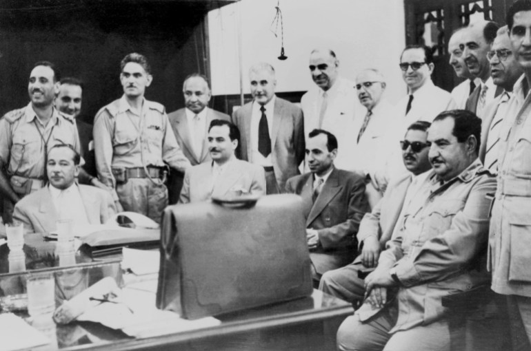 From left, seated: Iraqi politician Abdul Salam Arif (1921-1966) and Iraqi Prime minister brigadier Abdul-Karim Qassem (1914-1963), are surrounded by the members of Iraqi pan-Arab Ba'ath (Renaissance) party in the 1960s in Baghad. On July 1958, Qassem and his followers overthrew the monarchy and Qassem was named the Premier of the newly formed Republic of Iraq. He was killed in February 1963 after a phony trial. Abdul Salam Arif (1921-1966) assumed then the presidency. AFP PHOTO (Photo by AFP)