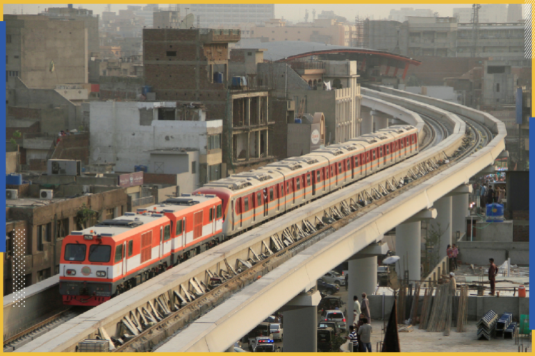 Orange Line Metro Train (OLMT) on its first test-run, travels along a track in a neighbourhood in Lahore, Pakistan May 16, 2018. REUTERS/Mohsin Raza