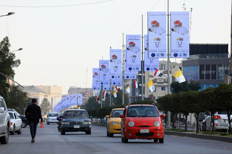 Preparations underway ahead of Pope's visit to Iraq Preparations underway ahead of Pope's visit to Iraq- - BAGHDAD, IRAQ - MARCH 03: Cars pass by posters welcoming Pope Francis in Iraq's capital Baghdad on March 3, 2021. Pope Francis is set to be in Iraq from March 5 to 8 with an ambitious programme that will take round the country. DATE 03/03/2021